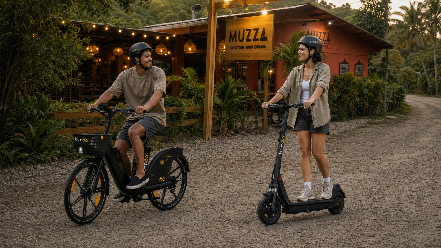 Man riding a Bimba electric bike beside a woman riding a Bimba branded electric scooter outside Muzz in Santa Teresa, Costa Rica