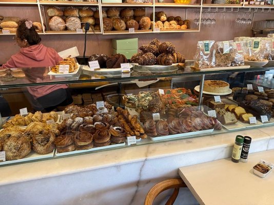 Fresh bread and pastries inside The Bakery near a Bimba parking location