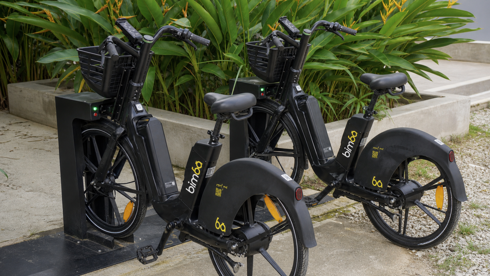 Two black Bimba electric bikes organized at physical charging docks