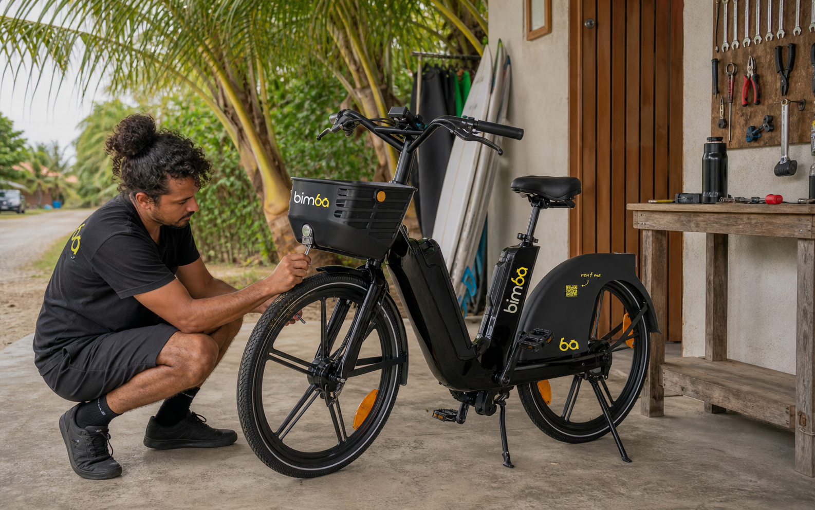 Bimba fleet technician inspecting a shared electric bike in Santa Teresa, Costa Rica